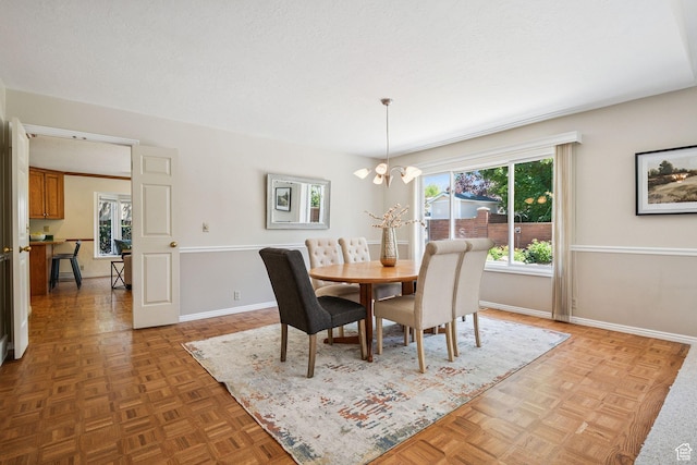 2056 E Sierra View Cir, Millcreek, UT 84109 - dining area featuring a chandelier and baseboards