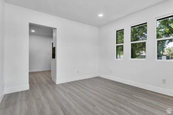 9593 S 700 E, Sandy, UT 84070 - empty room with wood finished floors and recessed lighting