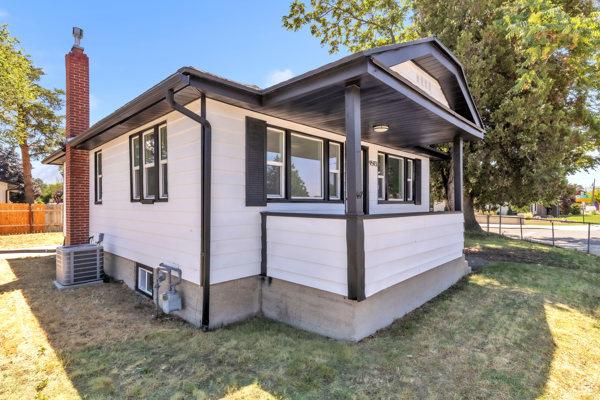 9593 S 700 E, Sandy, UT 84070 - view of home's exterior with a chimney and a central air condition unit