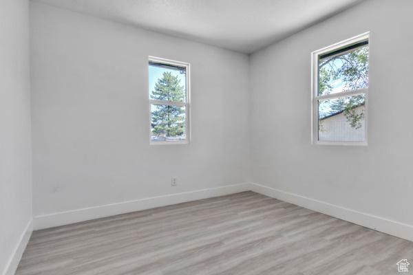 9593 S 700 E, Sandy, UT 84070 - empty room with baseboards and light wood finished floors