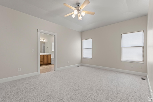4713 W 4050 S, West Haven, UT 84401 - unfurnished bedroom featuring light carpet, ensuite bathroom, a ceiling fan, and vaulted ceiling