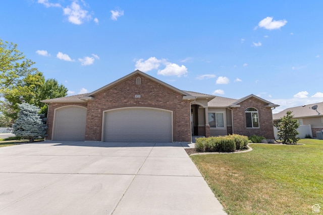 4713 W 4050 S, West Haven, UT 84401 - ranch-style house featuring an attached garage, brick siding, a front yard, and concrete driveway