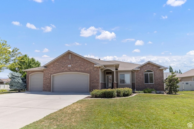 4713 W 4050 S, West Haven, UT 84401 - ranch-style home with a garage, brick siding, and concrete driveway
