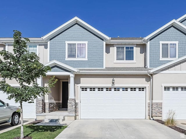 947 S 2040 W, Orem, UT 84059 - craftsman-style house featuring stone siding, driveway, and an attached garage