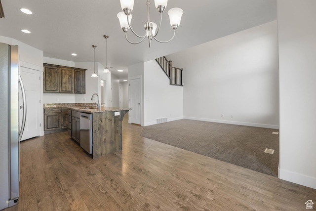 947 S 2040 W, Orem, UT 84059 - kitchen featuring stainless steel appliances, recessed lighting, a center island with sink, dark wood-style flooring, and decorative light fixtures