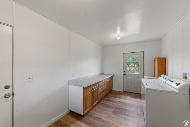 16 N Porcupine Ln, La Sal, UT 84530 - laundry area with light wood-style floors, cabinet space, and washer and clothes dryer