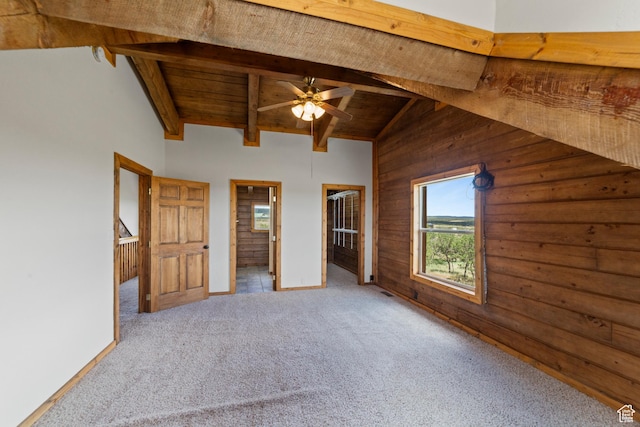 16 N Porcupine Ln, La Sal, UT 84530 - unfurnished bedroom with a wooden ceiling with exposed beams, carpet floors, wooden walls, high vaulted ceiling, and ensuite bath