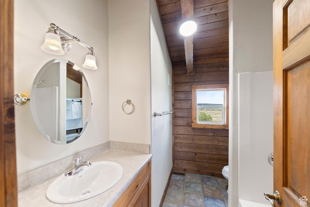 16 N Porcupine Ln, La Sal, UT 84530 - bathroom with wooden walls, vanity, stone finish flooring, lofted ceiling, and wood ceiling