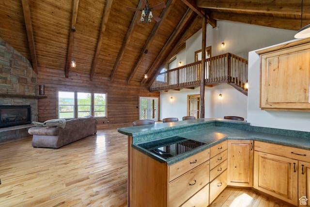 16 N Porcupine Ln, La Sal, UT 84530 - kitchen with a wooden ceiling with exposed beams, light wood-type flooring, black electric cooktop, light brown cabinetry, and dark countertops