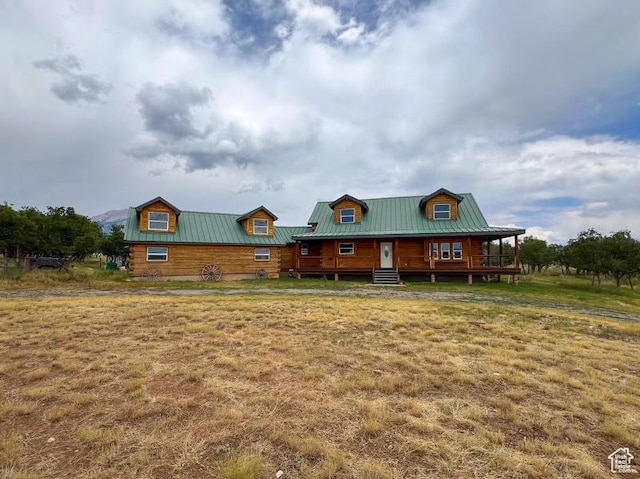 16 N Porcupine Ln, La Sal, UT 84530 - log home featuring a front lawn, a metal roof, and a standing seam roof