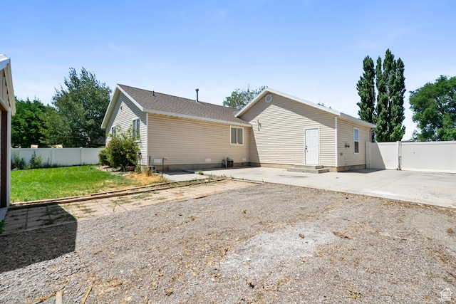 1215 W 125 S, Lehi, UT 84043 - rear view of property featuring a patio and a fenced backyard