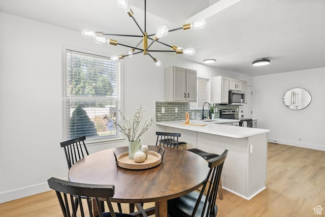 1215 W 125 S, Lehi, UT 84043 - dining space with a chandelier and light wood finished floors