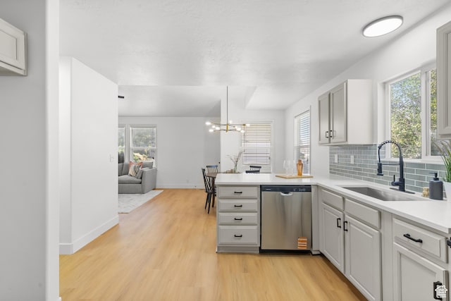 1215 W 125 S, Lehi, UT 84043 - kitchen featuring dishwasher, light wood finished floors, a peninsula, and plenty of natural light