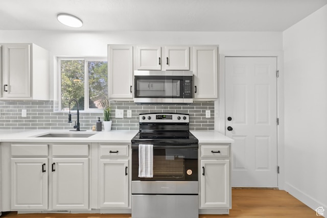 1215 W 125 S, Lehi, UT 84043 - kitchen featuring stainless steel appliances, white cabinetry, and tasteful backsplash