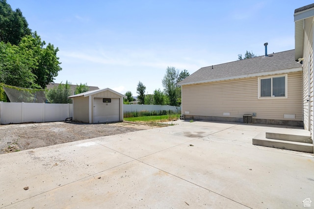 1215 W 125 S, Lehi, UT 84043 - view of patio / terrace with a detached garage, an outdoor structure, and driveway