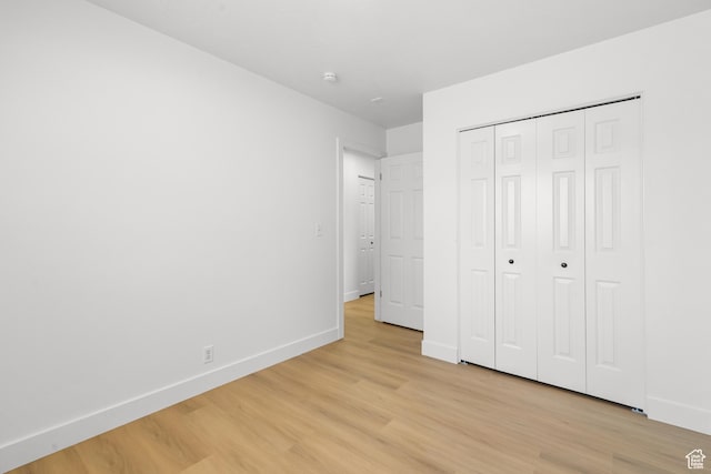 1215 W 125 S, Lehi, UT 84043 - unfurnished bedroom with light wood finished floors and a closet