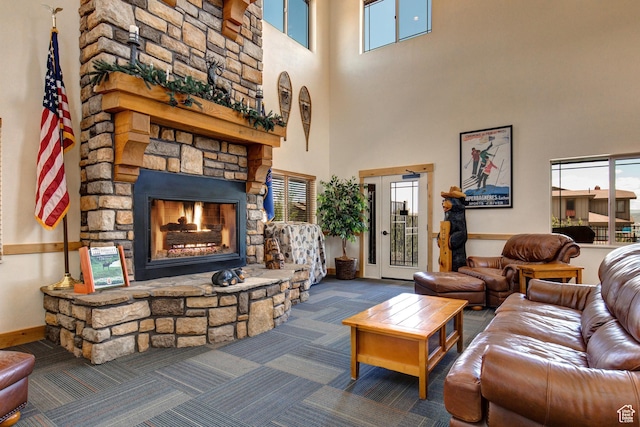 5541 N Slalom Way, Park City, UT 84098 - carpeted living area featuring healthy amount of natural light, a towering ceiling, and a stone fireplace