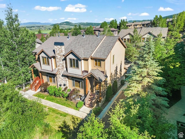 5541 N Slalom Way, Park City, UT 84098 - view of front of home with a chimney, a mountain view, and a shingled roof