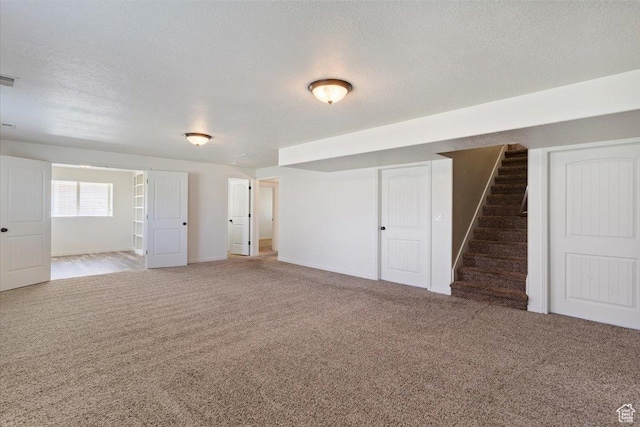 5464 S 3200 W, Roy, UT 84067 - below grade area featuring carpet, stairs, and a textured ceiling