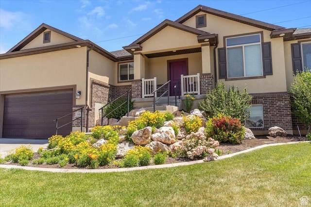 5464 S 3200 W, Roy, UT 84067 - view of front of home featuring brick siding, stucco siding, an attached garage, and a front yard