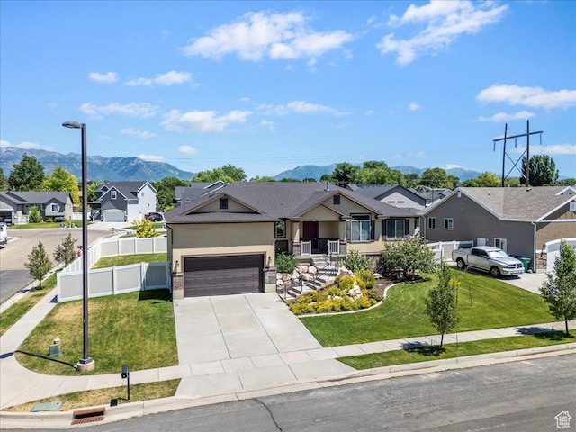 5464 S 3200 W, Roy, UT 84067 - view of front of property featuring a residential view, concrete driveway, a mountain view, stucco siding, and a garage