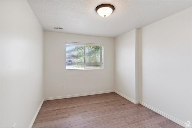5464 S 3200 W, Roy, UT 84067 - spare room featuring light wood-style flooring and a textured ceiling