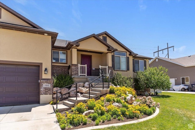 5464 S 3200 W, Roy, UT 84067 - view of front of home with stucco siding, covered porch, a front lawn, brick siding, and concrete driveway