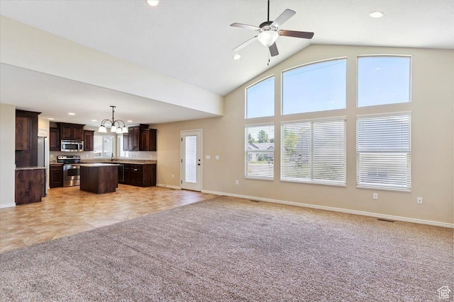 5464 S 3200 W, Roy, UT 84067 - unfurnished living room featuring light carpet, recessed lighting, a chandelier, a ceiling fan, and high vaulted ceiling