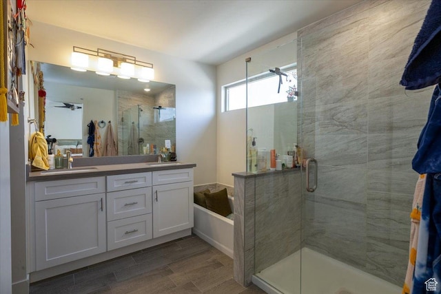 2049 N Harvest Village Ln, Saratoga Springs, UT 84045 - bathroom with double vanity, a shower stall, a bath, and wood finish floors