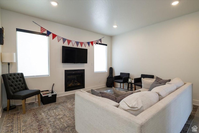 2049 N Harvest Village Ln, Saratoga Springs, UT 84045 - living room featuring a glass covered fireplace, recessed lighting, and wood finished floors