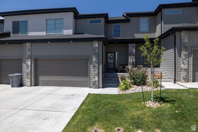 2049 N Harvest Village Ln, Saratoga Springs, UT 84045 - view of front of house with an attached garage, driveway, a front yard, and stone siding