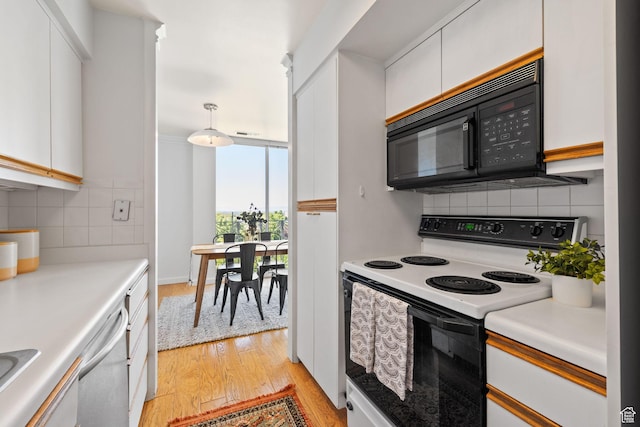 777 E S Temple Unit 4A, Salt Lake City, UT 84102 - kitchen with white electric range, black microwave, light wood finished floors, tasteful backsplash, and white cabinets