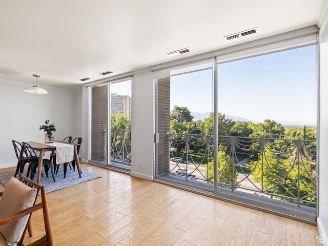 777 E S Temple Unit 4A, Salt Lake City, UT 84102 - dining room with light wood-style floors and floor to ceiling windows