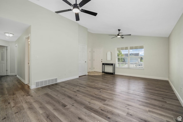 224 W Apple Ave, Saratoga Springs, UT 84045 - unfurnished living room with vaulted ceiling, a ceiling fan, and wood finished floors