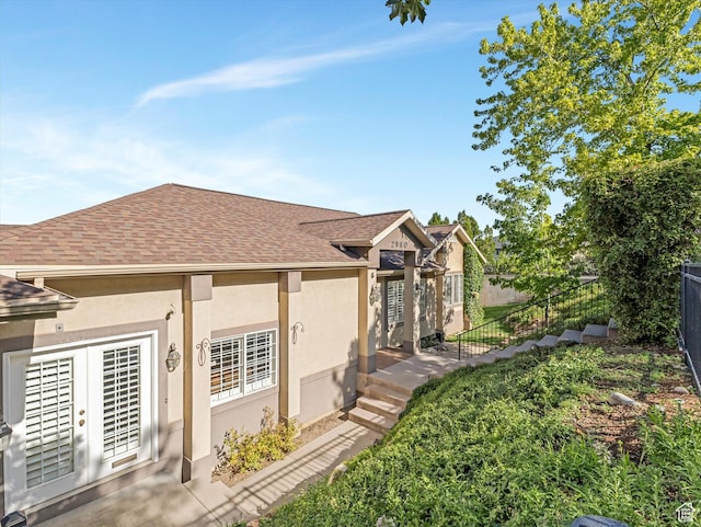 2960 E Oak Park Ln S, Holladay, UT 84117 - view of side of home featuring roof with shingles and stucco siding