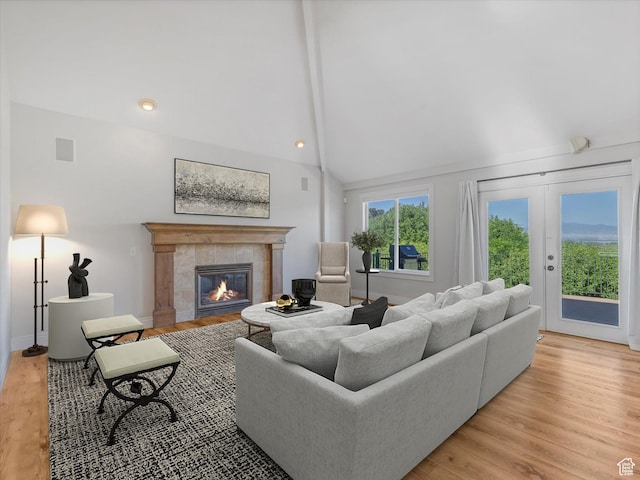 2960 E Oak Park Ln S, Holladay, UT 84117 - living room with a fireplace, light wood finished floors, and high vaulted ceiling