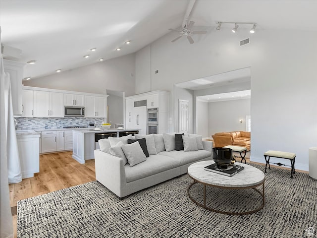 2960 E Oak Park Ln S, Holladay, UT 84117 - living area with ceiling fan, light wood finished floors, and high vaulted ceiling