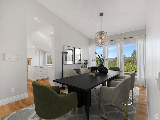 2960 E Oak Park Ln S, Holladay, UT 84117 - dining space featuring a chandelier, vaulted ceiling, and light wood finished floors