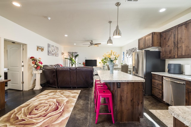 1018 S Valley View Ct, Moab, UT 84532 - kitchen with appliances with stainless steel finishes, light countertops, recessed lighting, open floor plan, and a ceiling fan