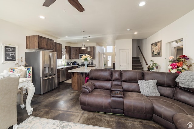 1018 S Valley View Ct, Moab, UT 84532 - living area with concrete flooring, stairs, recessed lighting, and a ceiling fan