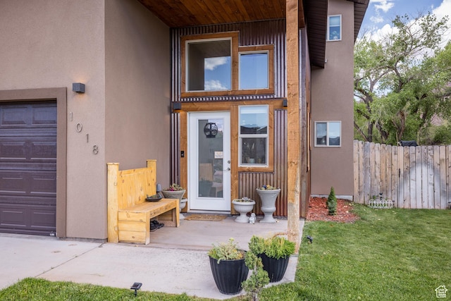 1018 S Valley View Ct, Moab, UT 84532 - entrance to property featuring stucco siding and a garage