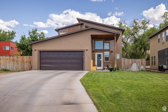 1018 S Valley View Ct, Moab, UT 84532 - view of front of home featuring driveway, stucco siding, and a garage