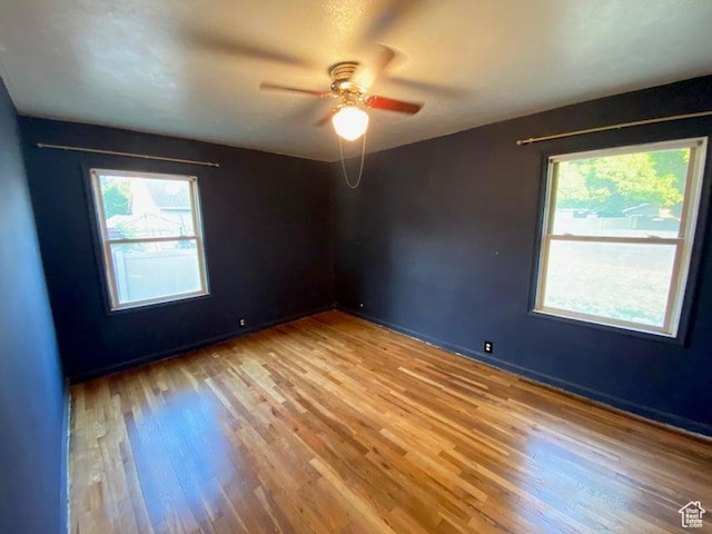 41 N 300 E, Richfield, UT 84701 - empty room with plenty of natural light, light wood-style flooring, and a ceiling fan