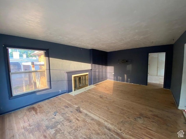 41 N 300 E, Richfield, UT 84701 - unfurnished living room with a fireplace with flush hearth and wood finished floors