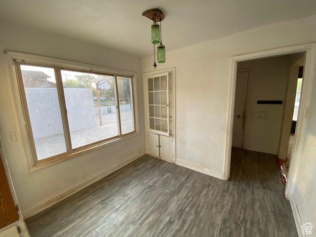 41 N 300 E, Richfield, UT 84701 - unfurnished dining area featuring baseboards and dark wood-style flooring