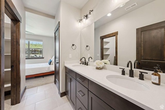 14482 N Buck Horn Trl Unit 50A, Heber City, UT 84032 - bathroom with double vanity, connected bathroom, a closet, and tile patterned flooring
