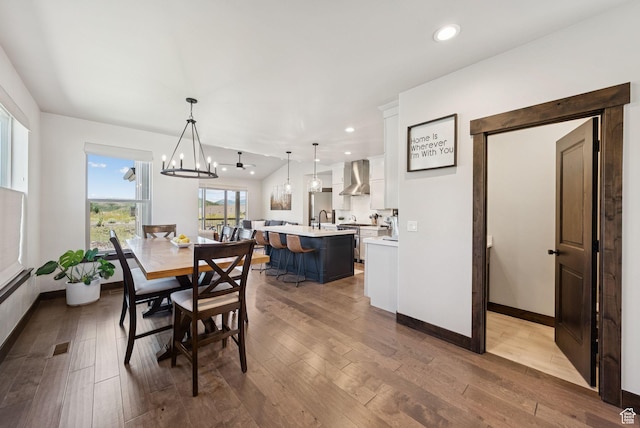 14482 N Buck Horn Trl Unit 50A, Heber City, UT 84032 - dining area with hardwood / wood-style floors, a chandelier, and recessed lighting