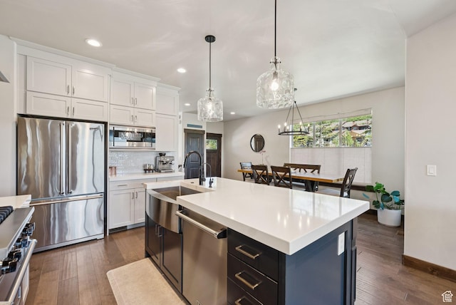 14482 N Buck Horn Trl Unit 50A, Heber City, UT 84032 - kitchen featuring appliances with stainless steel finishes, recessed lighting, light countertops, white cabinetry, and dark wood-style flooring