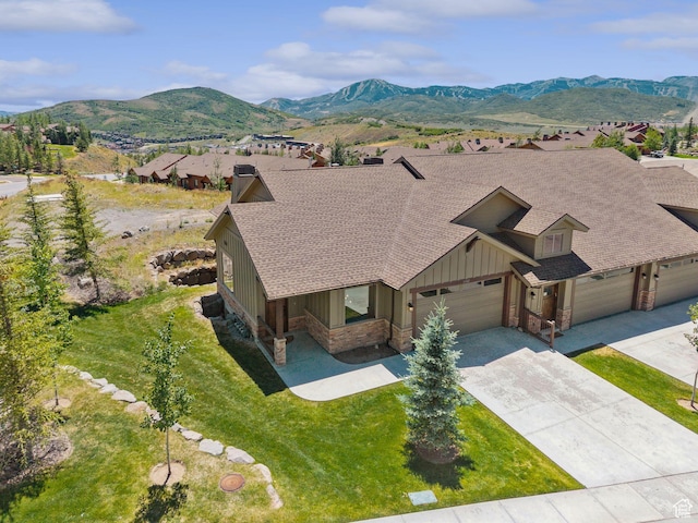 14482 N Buck Horn Trl Unit 50A, Heber City, UT 84032 - view of front of home with board and batten siding, roof with shingles, concrete driveway, a mountain view, and an attached garage