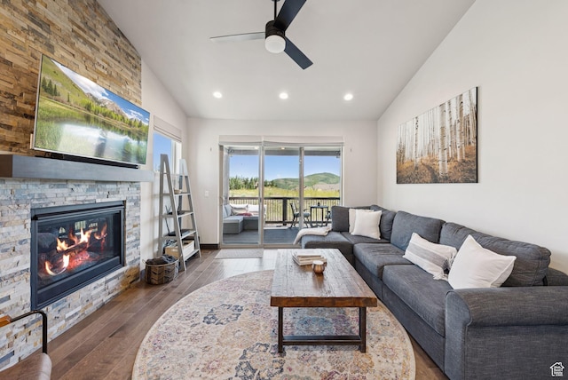 14482 N Buck Horn Trl Unit 50A, Heber City, UT 84032 - living room featuring ceiling fan, wood finished floors, a stone fireplace, recessed lighting, and high vaulted ceiling